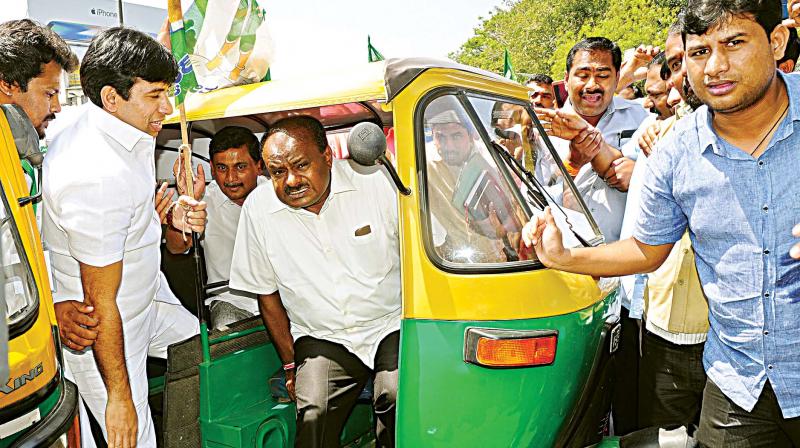 JD(S) state president H.D. Kumaraswamy during an  interaction with auto drivers in Bengaluru.