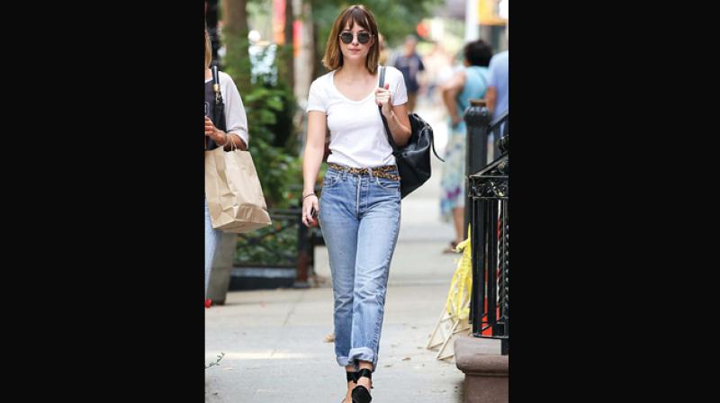 Dakota Johnson gets it so right with high waist jeans.