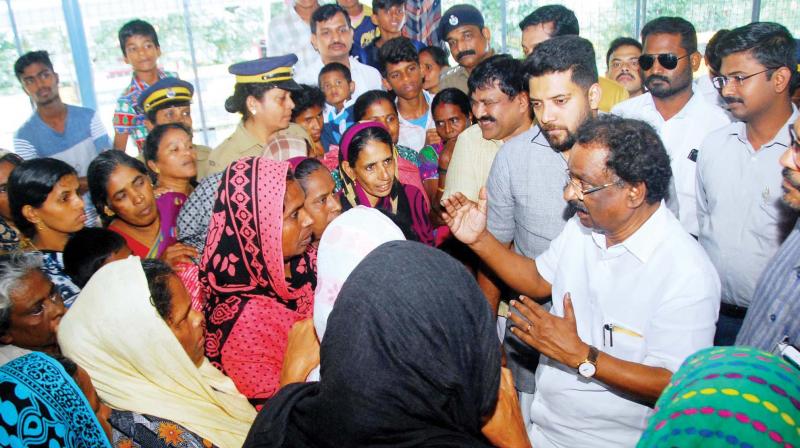 SC/ST development minister A.K. Balan interacts with inmates at a relief camp in Olavenkode, Palakkad on Saturday. Shafi Parambil, MLA, M.B. Rajesh, MP, are also seen. (Photo: DC)