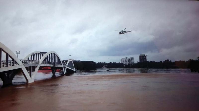 A Coast Guard helicopter undertakes a recce of the river Periyar at Aluva.