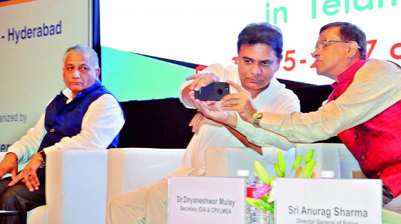 Telangana state minister K.T. Rama Rao and secretary (OIA & CPA), MEA, Dnyaneshwar Mulay take a selfie at the first MEA-TD outreach conference on consular, passport and diaspora issues, at HICC in Hyderabad on Saturday.  DC