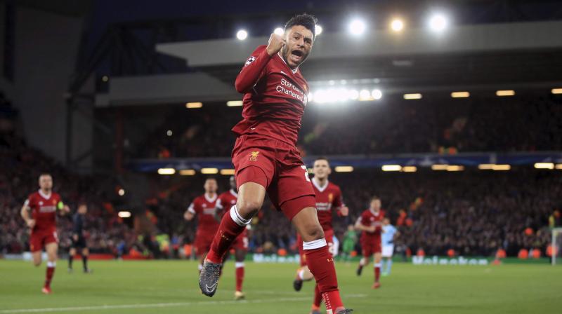 Alex Oxlade-Chamberlain celebrates after scoring goal against Manchester City  during the Champions League quarter final. (Photo: AP)