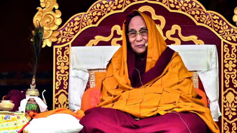 Exiled Tibetan spiritual leader the Dalai Lama delivers religious teachings to Buddhist followers at the Buddha Stadium in Bomdila Wednesday. (Photo: AFP)
