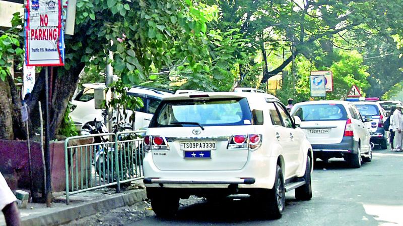 A top police officers car is parked right in front of a No Parking signboard near the Mahankali traffic police station on Thursday. (S. Surender Reddy)