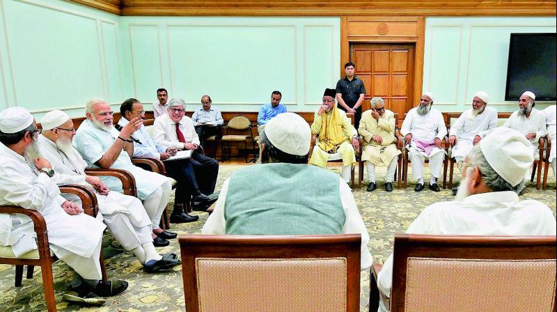 A delegation of leaders from the Muslim community under the umbrella of the Jamiat Ulama-i-Hind meet Prime Minister Narendra Modi in New Delhi on Tuesday. (Photo: PTI)