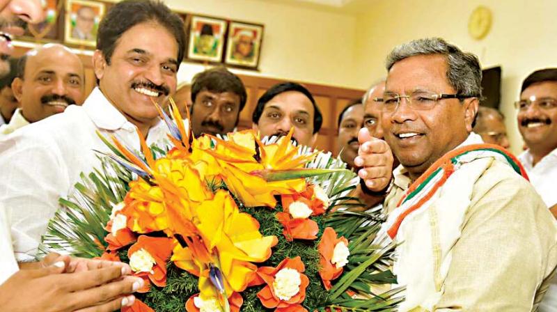 Chief Minister Siddaramaiah with Congress general secretary K C Venugopal in Bengaluru on Tuesday. (Photo: DC)