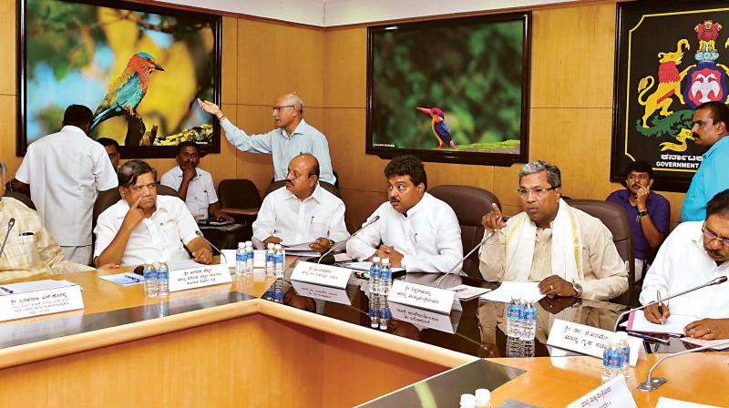 Chief Minister Siddaramaiah addresses a meeting of floor leaders of the state legislature on the Cauvery river water dispute in Bengaluru on Tuesday. Ministers Dr G. Parameshwar, M.B. Patil and T.B. Jayachandra, and BJP leader Jagadish Shettar are seen. (Photo: DC)