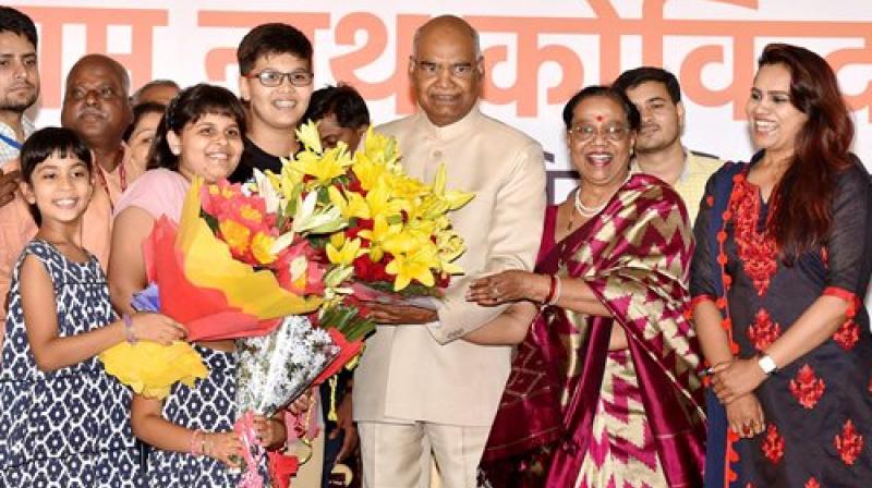 Ram Nath Kovind along with his wife Savita accepting greetings on being elected as the 14th President of India, in New Delhi on Thursday. (Photo: PTI)