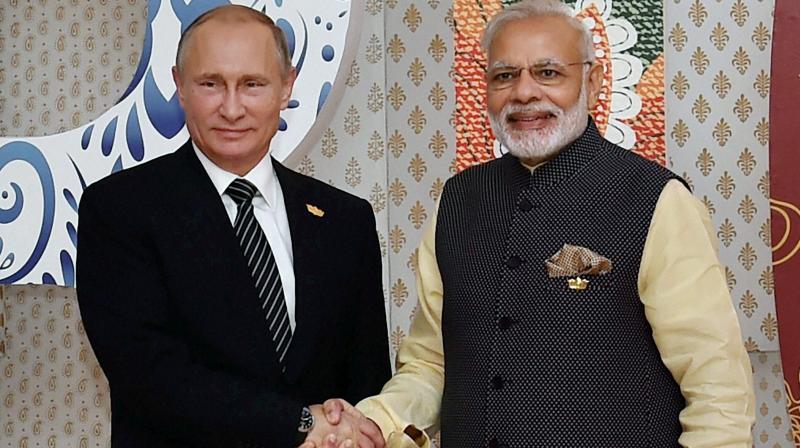 Prime Minister Narendra Modi welcomes Russian President Vladimir Putin for the BRICS Summit in Benaulim, Goa on Sunday. (Photo: PTI)