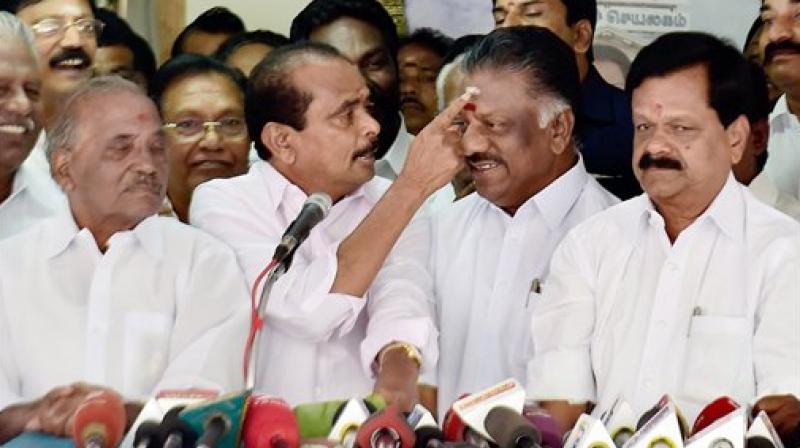 Chief Minister O Panneerselvam with Krishnagiri MP Ashok Kumar and Namakkal MP P. R. Sundaram who joined his camp at his official residence in Chennai on Saturday. (Photo: PTI)