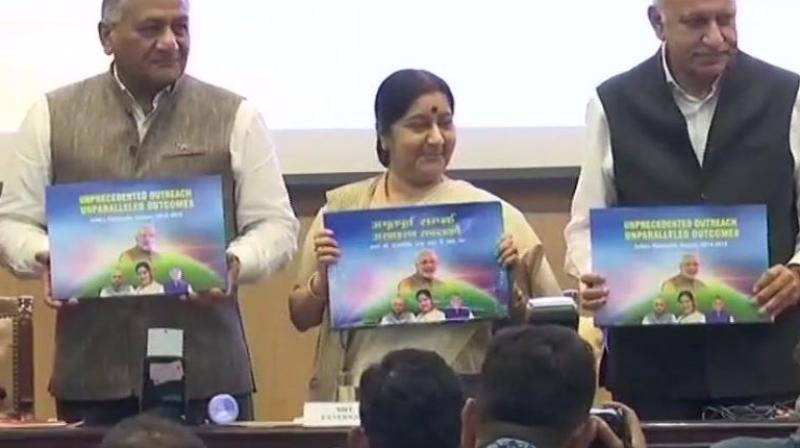 On the occassion, Swaraj also released a book on the achievements of the Ministry of External Affairs over the course of her tenure. (Photo: ANI | Twitter)