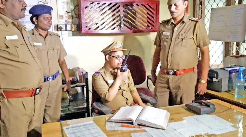 Stevin Mathew on duty at Ashok Nagar police station on Friday. (Photo: DC)