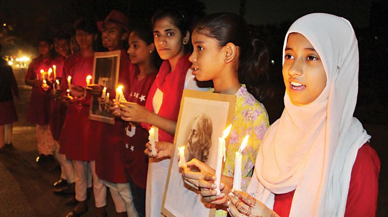 A candle walk, remembering Tagore, on the concluding day.