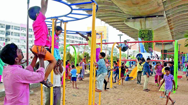 Children enjoy themselves at the F1H2O park under the Kanakadurga flyover, in Vijayawada on Monday. 	 Deccan chronicle