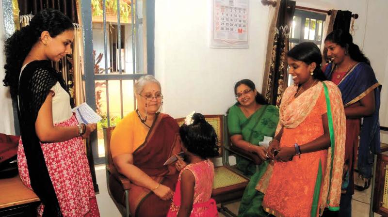 A girl who is on foster care interacts with Kerala State Commission for Protection of Child Rights Chairperson Sobha Koshy and dubbing artist Bhagyalakshmi at Childrens Home, Poojapura on Saturday. (Photo: A. V. MUZAFAR)