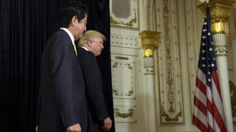 US President Donald Trump and Japanese Prime Minister Shinzo Abe leave the room after making statements about the North Korean missile launch at Mar-a-Lago in Palm Beach. (Photo: AP)