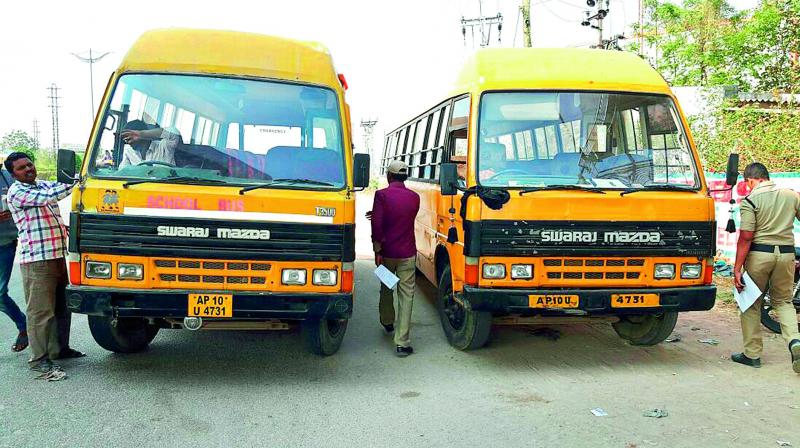The two school buses of Krishnaveni Concept School with the same registration number.