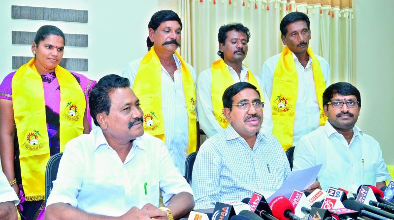 Minister P. Narayana, MLC Beeda Ravichandra (right) and former legislator Parasa Rathnam introduce some YSRC local body members after they joined the party on Tuesday. (Photo: DC)