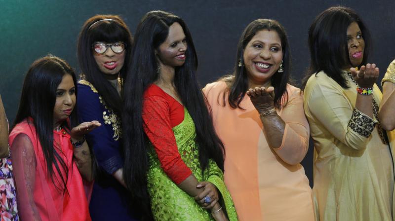 Acid attack victims pose on a ramp during a fashion show on the eve of International Womens Day in Thane, outskirts of Mumbai. (Photo: PTI)