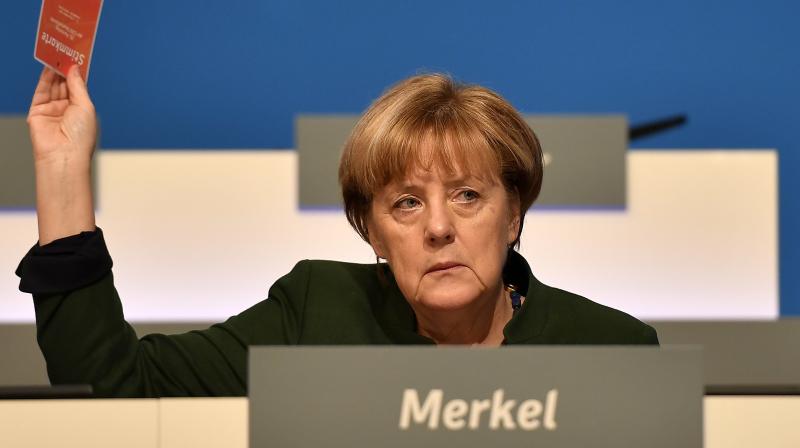 German chancellor Angela Merkel votes at the general party conference of the Christian Democratic Union, CDU, in Essen, Germany. (Photo: AP)