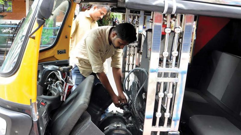 An auto driver filling LPG in city on Tuesday.	(Photo: Venugopal)