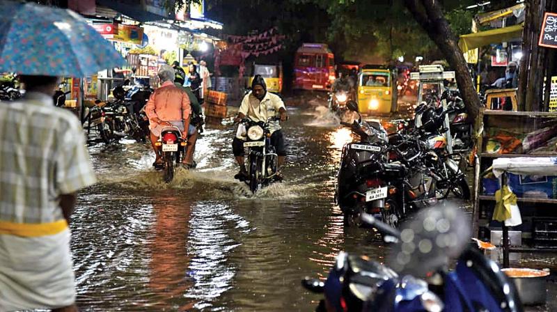 Streets are flooded after a sudden heavy downpour on Wednesday evening in Chennai. (Photo: DC)