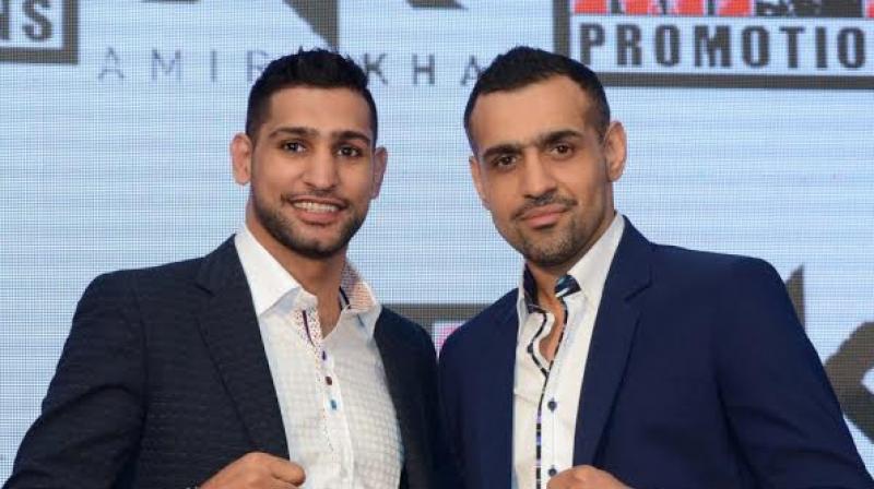 Bill Dosanjh (right) hopes to follow the Formula One model, in his efforts to grow MMA in the world.