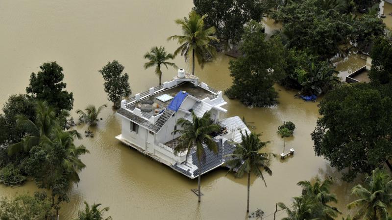 A house is partially submerged in flood waters in Chengannur in Kerala. (Photo: AP)