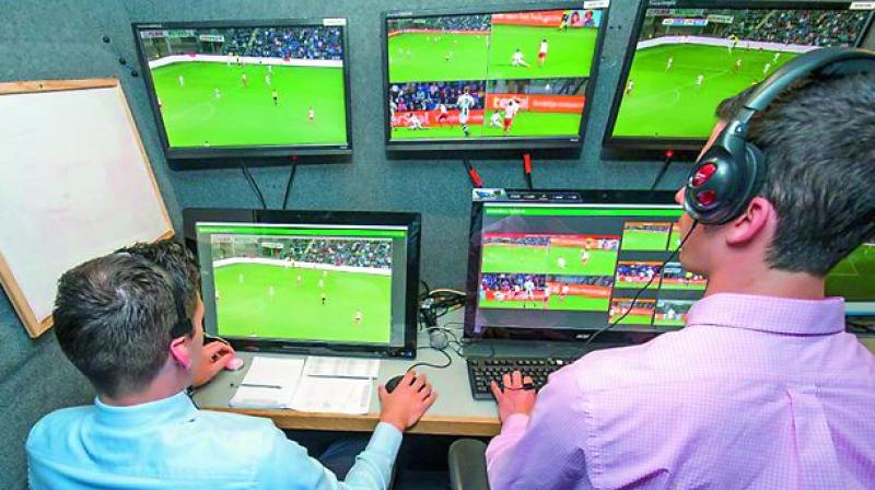 Video Assistant Referee and his team monitoring the match.