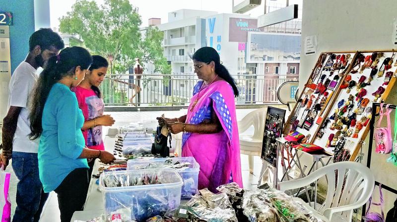 Commuters shop at the Begumpet Metro station stalls, which have been put together by Hasthakshar, on Tuesday. The next stop for such a venture could well be Ameerpet. (Image: DC)