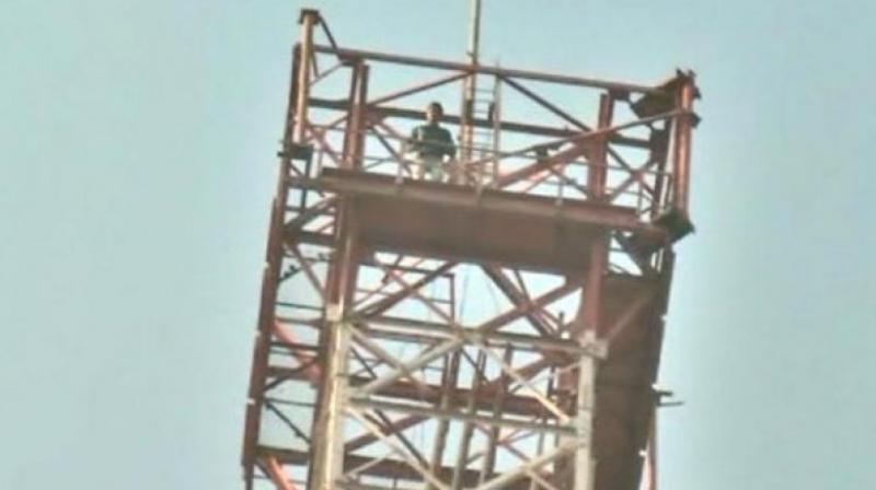 Upendra Singh Rathore climbed the 350-feet tall tower, saying he will descend only when the movie is banned across the country. (Photo: ANI)