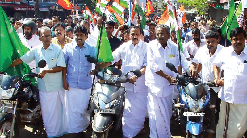UDF leaders take out a protest march during the dawn-to-dusk hartal observed in protest against the increase in fuel prices, in Kozhikode on Monday.