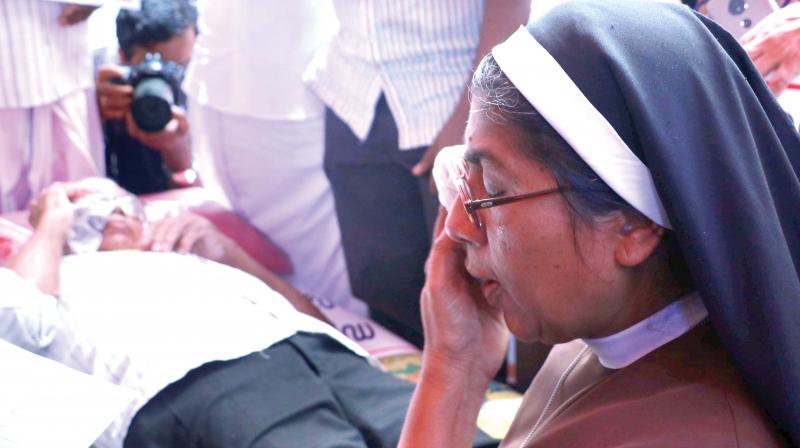 A nun who participates in the protest in Kochi demanding arrest of rape-accused Jalandhar Bishop Franco Mulakkal is unable to control her tears. (Photo: ARUN CHANDRABOSE)