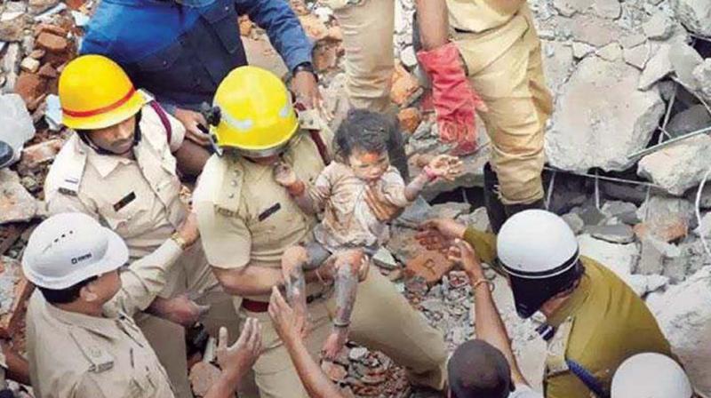 Three-year-old Sanjana being rescued from the debris of the Ejipura blast