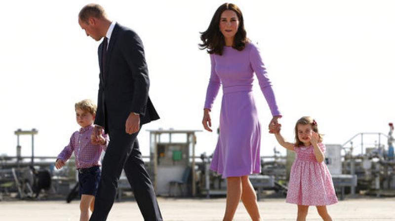 In this Friday, July 21, 2017 file photo Britains Prince William, second left, and his wife Kate, the Duchess of Cambridge, second right, and their children, Prince George, left, and Princess Charlotte, right are on their way to board a plane in Hamburg, Germany. (Photo: AP)