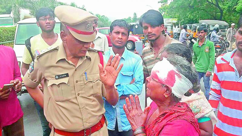 An injured woman is being shifted to a private hospital following an accident on the National Highway in Visakhapatnam on Monday. (Photo: DC)