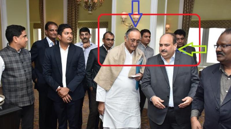 West Bengal BJP released photographs of state Finance Minister Amit Mitra with founder of Gitanjali Gems Mehul Choksi who is on the run in the Punjab National Bank (PNB) fraud case. (Photo: Twitter | @DilipGhoshBJP)