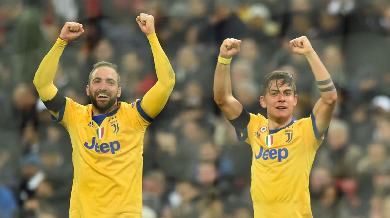 Juventus staged a stunning fightback against Tottenham to reach the Champions League quarter-finals 4-3 on aggregate after Paulo Dybala and Gonzalo Higuain sealed a dramatic 2-1 win in the last 16 second leg. (Photo: AFP)