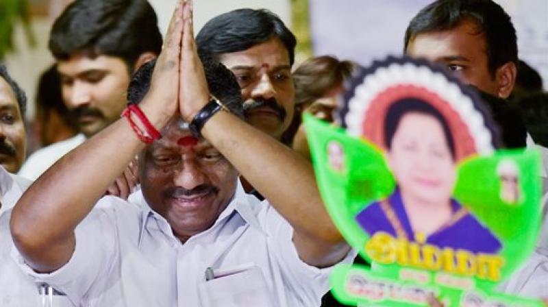 Tamil Nadu Chief Minister O Panneerselvam being greeted by various party supporters at his official residence in Chennai on Friday. (Photo: PTI)
