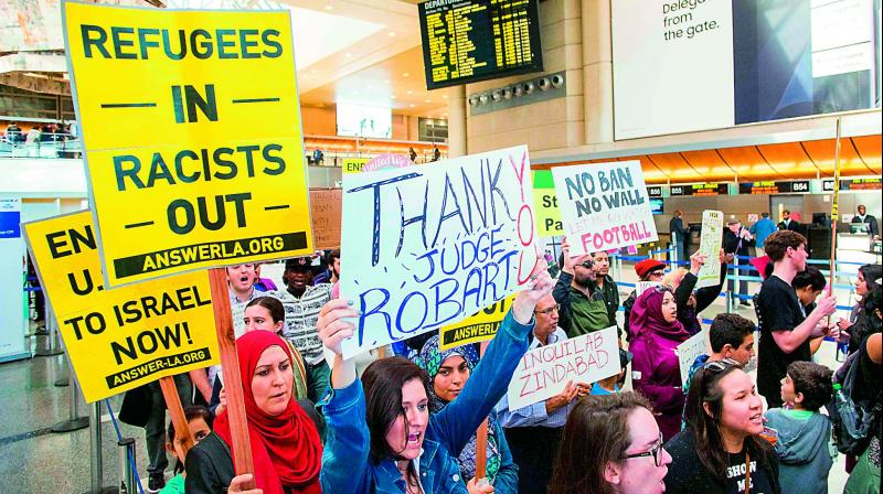 People protest the executive order by US President Donald Trump at the international airport in Los Angeles, California, on Sunday. 	(Photo:  AFP)