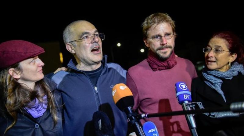 Activist Peter Steudtner (2nd R) of Germany and Ali Gharavi (2nd L) of Sweden talk to the media after their release from Silivri prison in Istanbul on October 26, 2017. (Photo: AFP)
