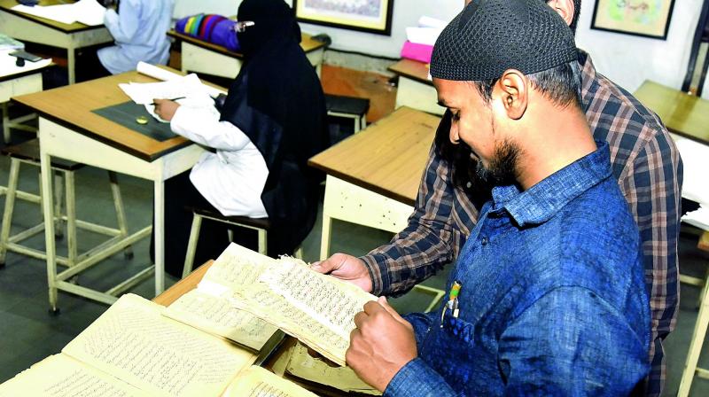 Books written in calligraphy style on display. 	 DC