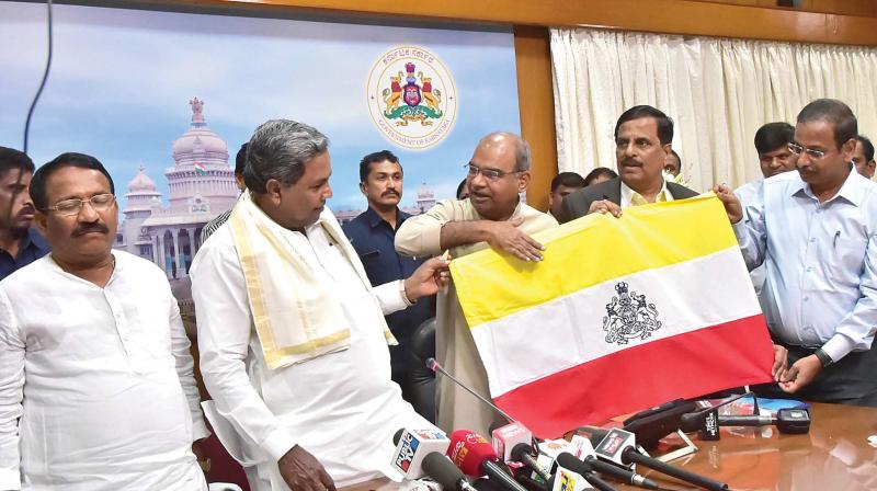 Chief Minister Siddaramaiah at the function where the proposed Kannada flag was unveiled, in Bengaluru on Thursday.
