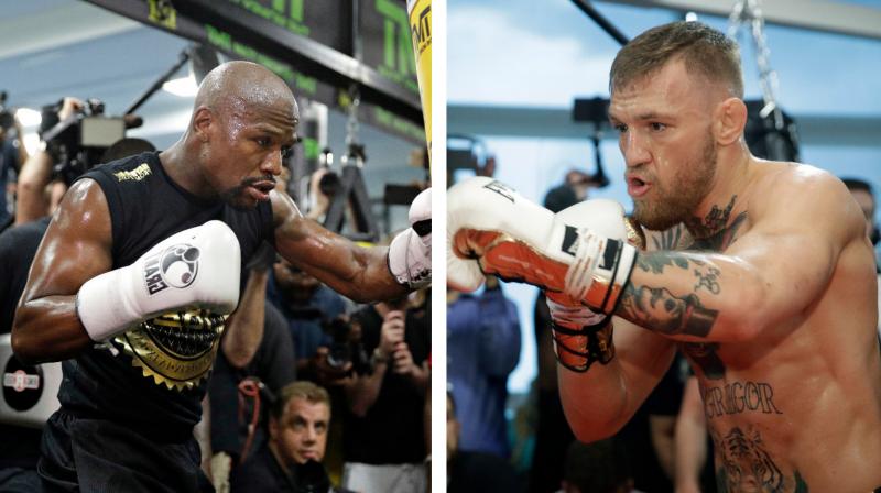 Move for lighter gloves is widely seen as benefiting both fighters as Mayweathers fast hands could be quicker with lighter gloves, while McGregor will be able to make his punching power more keenly felt.(Photo:AP)