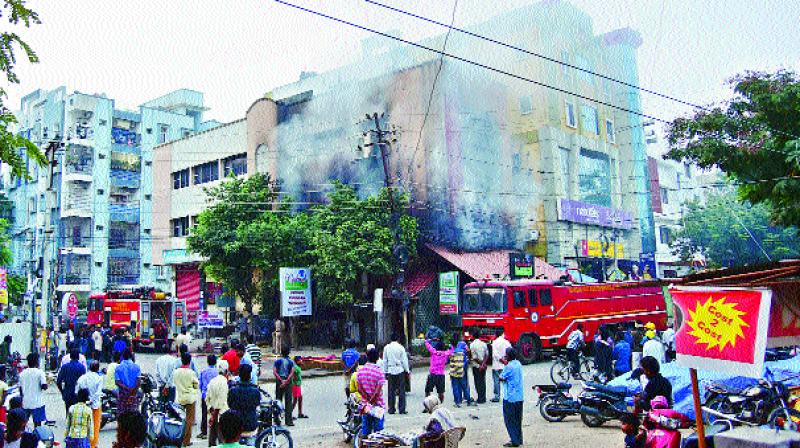 Fire broke out at the Gokool Restaurant in West Marredpally early on Saturday causing panic among residents of the building.  (Photo:  DC)