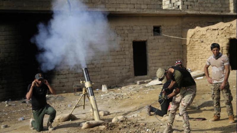 Iraqi army soldiers fire mortars against the Islamic State militants, at Shahrazad village 2 miles (3 kilometers) east of Mosul, Iraq. (Photo: AP)