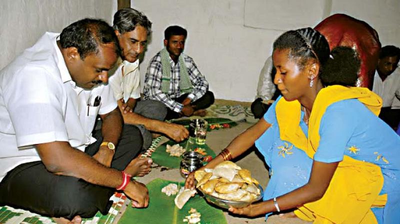 A file photo of H.D. Kumaraswamy having food during his village stay