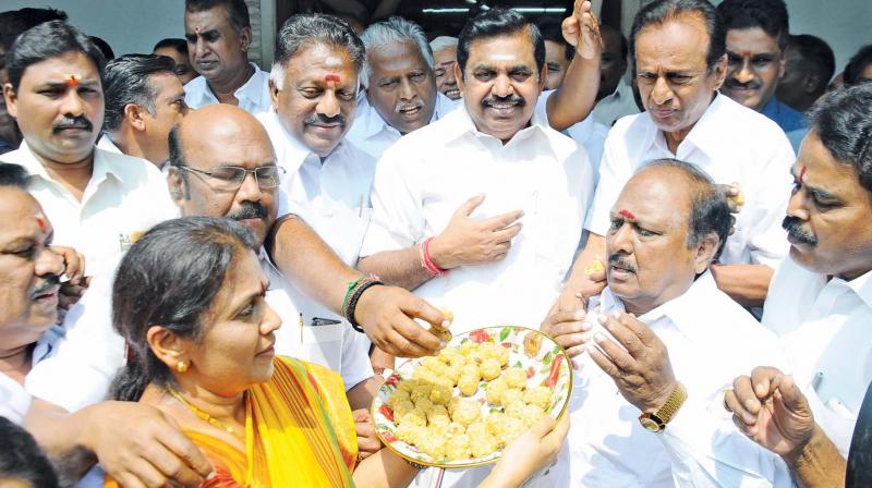 AIADMK womens wing members distribute sweets to celebrate the court verdict upholding the Speakers order on disqualifying the 18 MLAs.(Photo: DC)