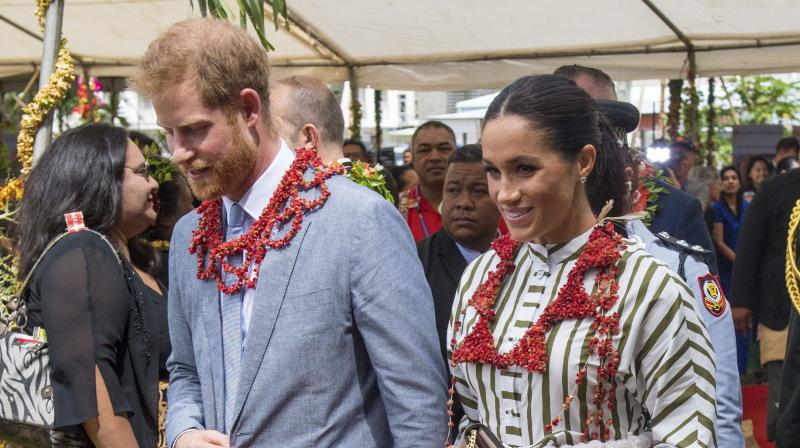 Britains Prince Harry and Meghan, Duchess of Sussex wear a taovala, a traditional Tongan dress wrapped around the waist, at the Faonelua Convention Centre in Nukualofa, Tonga, Friday, Oct. 26, 2018. (Photo: AP)