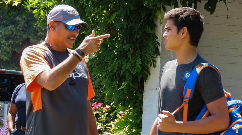 Arjun Tendulkar, who has often trained with the Indian team and last year, bowled to the England Test team, received some â€œwords of wisdomâ€ from the Indian cricket team coach Ravi Shastri. (Photo: PTI)